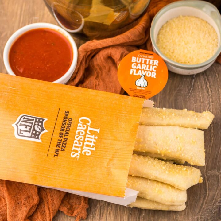 Copycat Little Caesar’s Crazy Bread served with marinara and cheese dipping sauce.