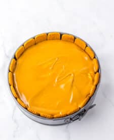 Cookie butter cheesecake filling spread evenly into the crust.