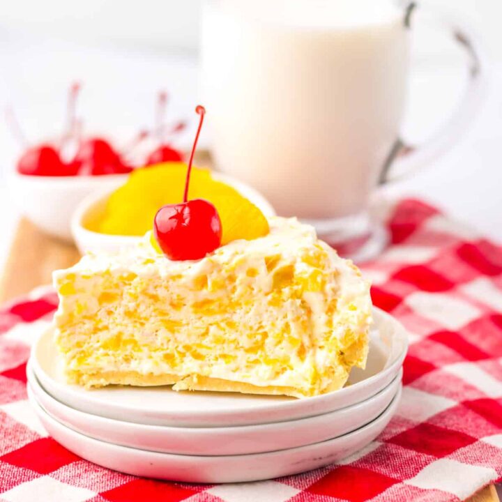 Plate with a slice of Pig Pickin Pie and a glass of milk.