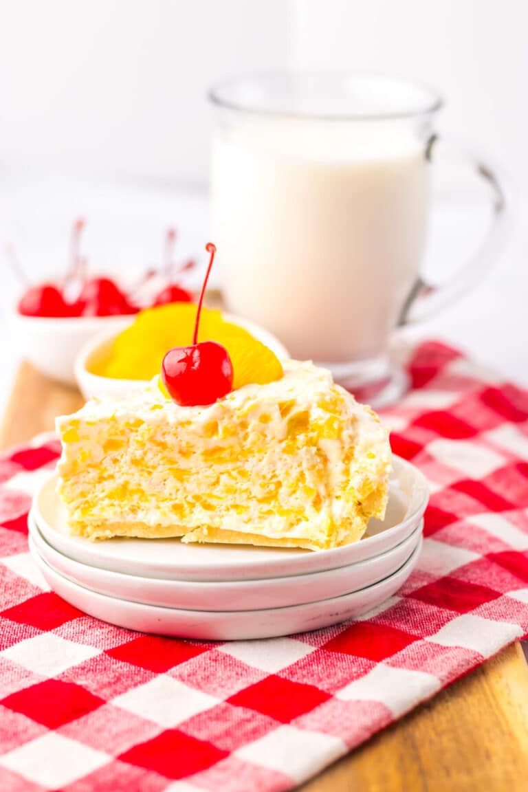 Plate with a slice of Pig Pickin Pie and a glass of milk.