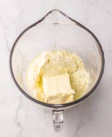 Cream cheese and base ingredients in a bowl before mixing.