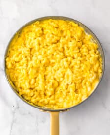 Creamy cheese sauce being prepared for mac and cheese.