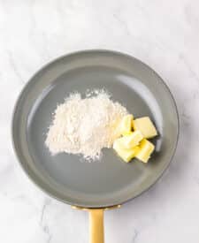 Butter and flour in a pan to start homemade mac and cheese sauce.