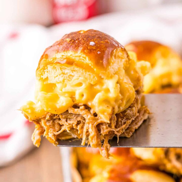 Close-up of gooey mac and cheese and pulled pork filling.