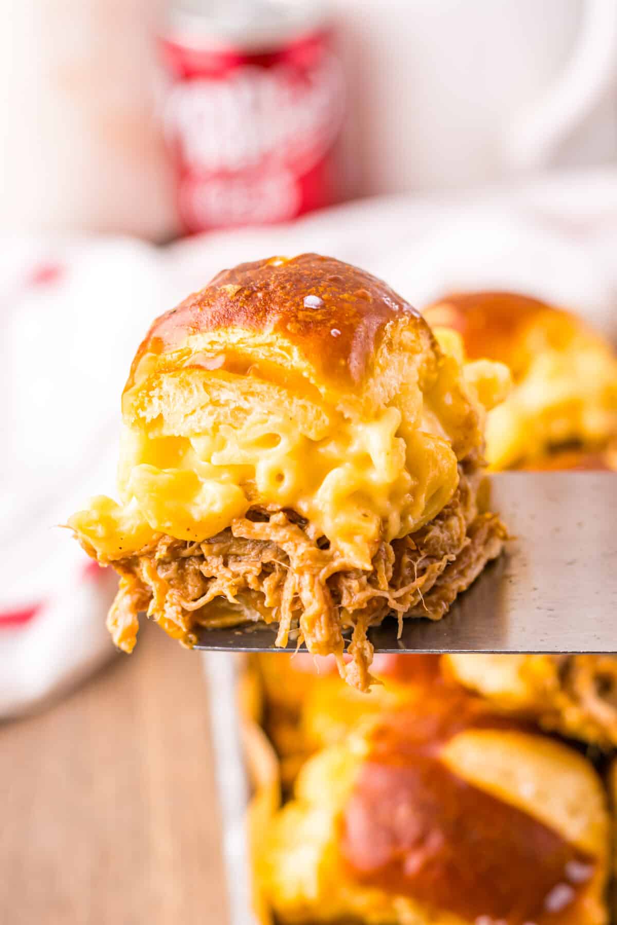 Close-up of gooey mac and cheese and pulled pork filling.