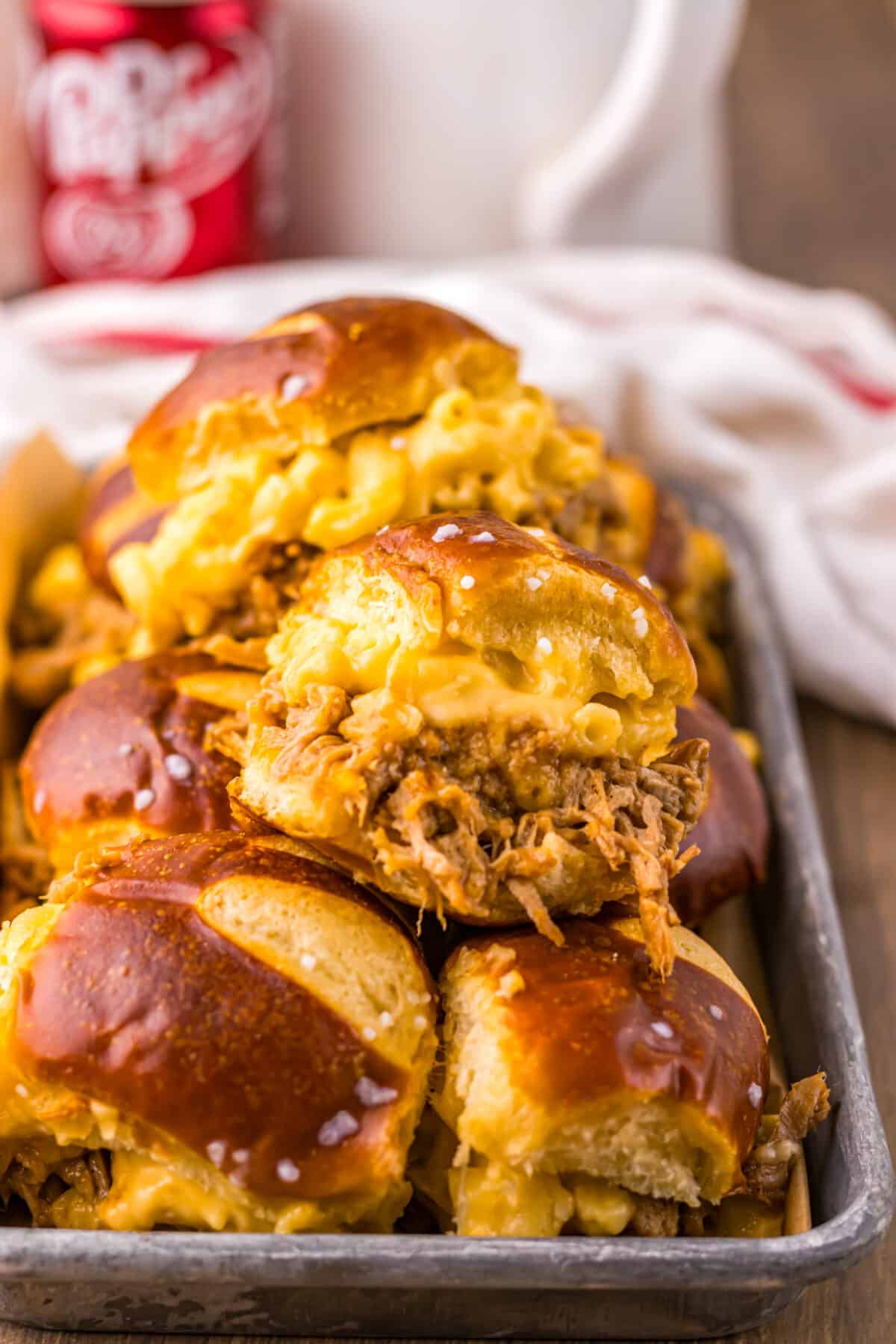 Dr Pepper pulled pork mac and cheese sliders baked until melty.