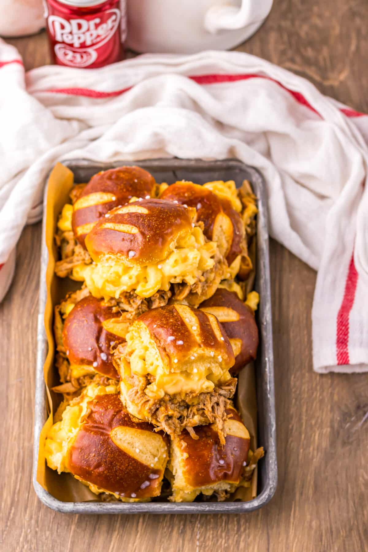 Dr Pepper pulled pork mac and cheese sliders baked until melty.