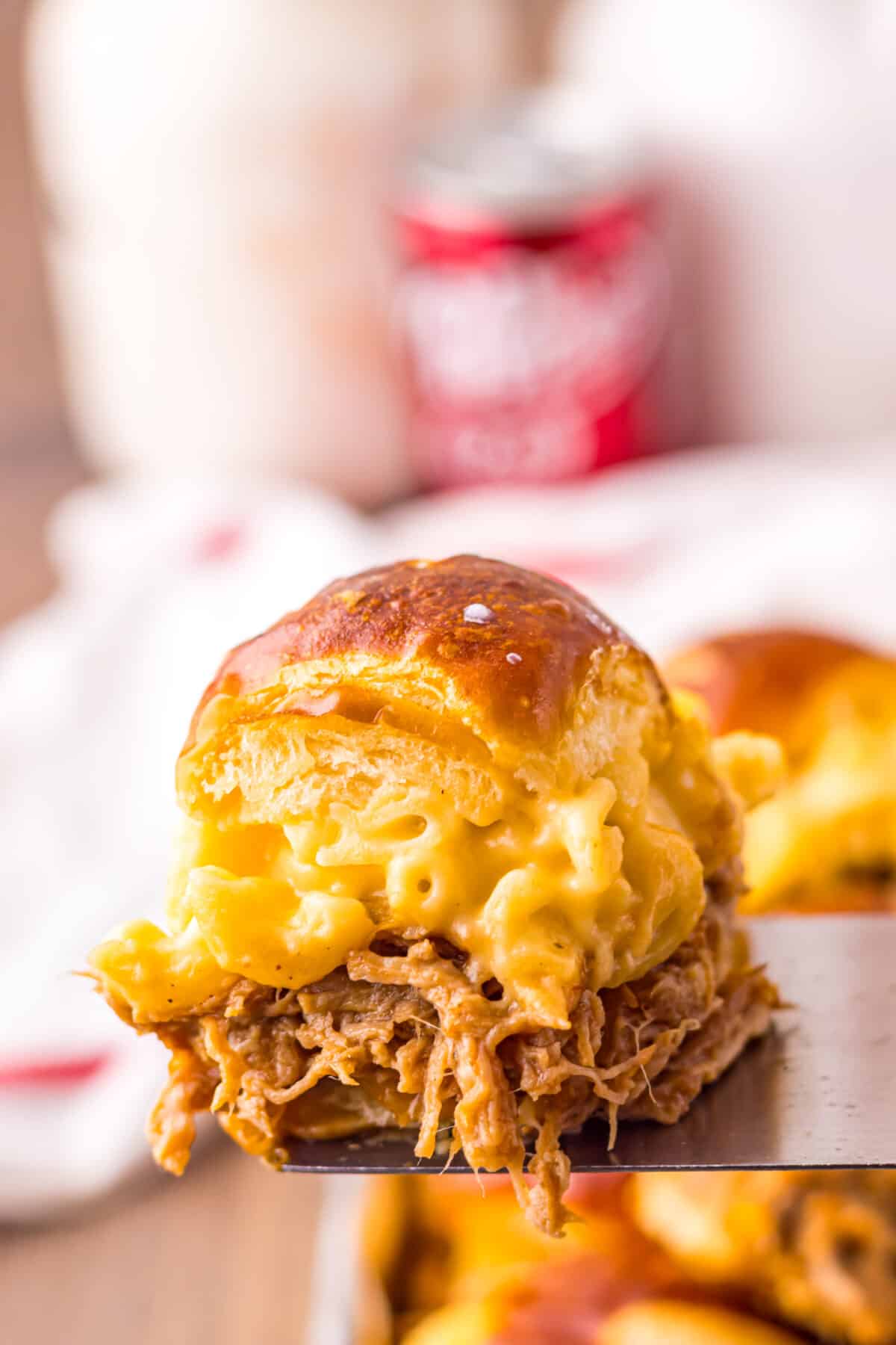 Close-up of gooey mac and cheese and pulled pork filling.