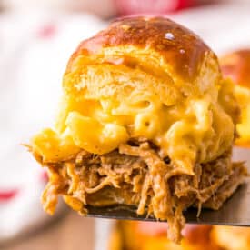 Close-up of gooey mac and cheese and pulled pork filling.