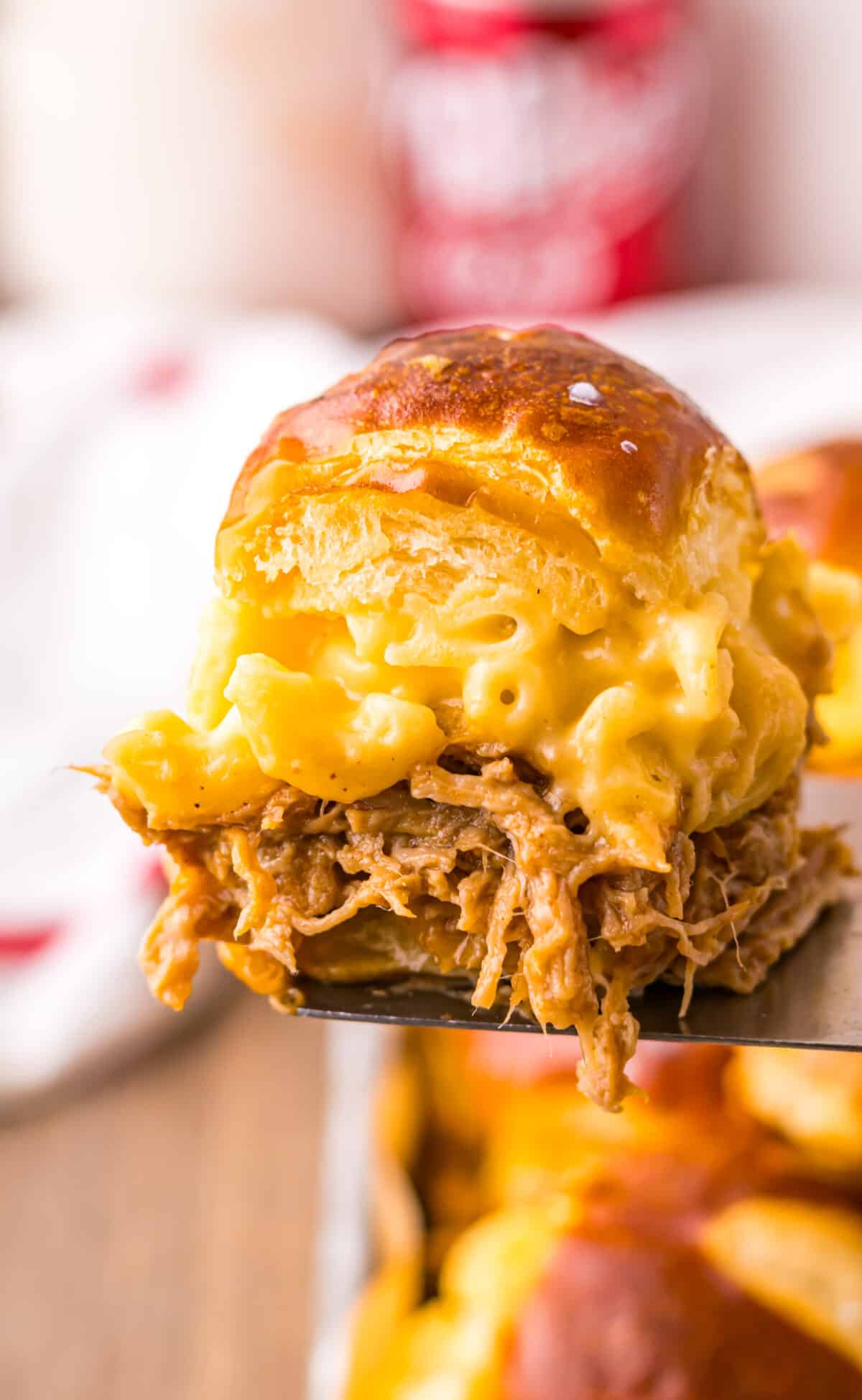 Close-up of gooey mac and cheese and pulled pork filling.