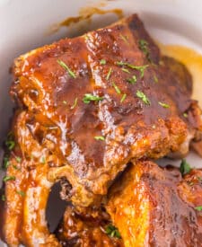 Close-up of tender ribs covered in thick Dr Pepper barbecue glaze.