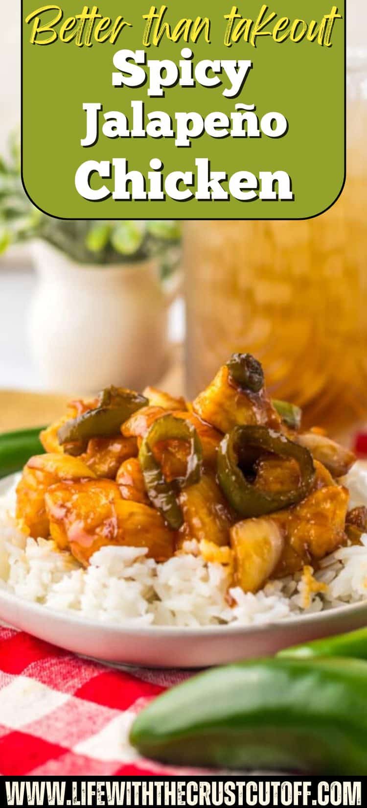 Bowl of spicy jalapeño chicken served over rice with sliced jalapeños and sticky savory sauce.