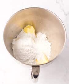 Butter and powdered sugar being mixed for lemon lime meltaways.
