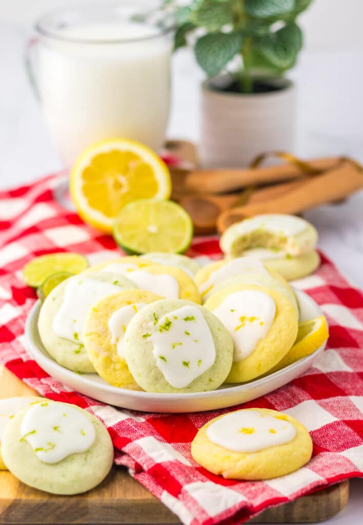 Close-up of glazed lemon lime cookies with fresh citrus slices.