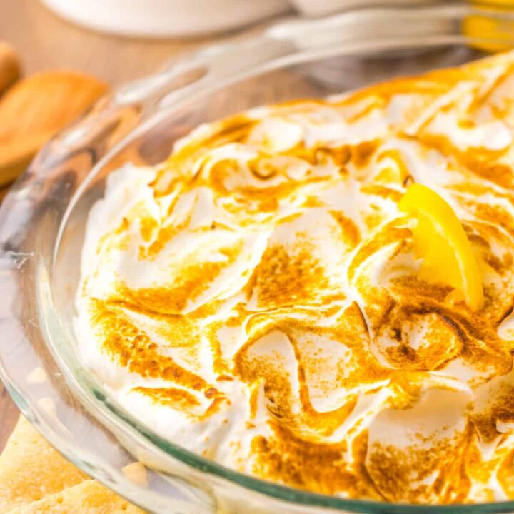 Close-up of creamy lemon dip with fluffy toasted meringue.