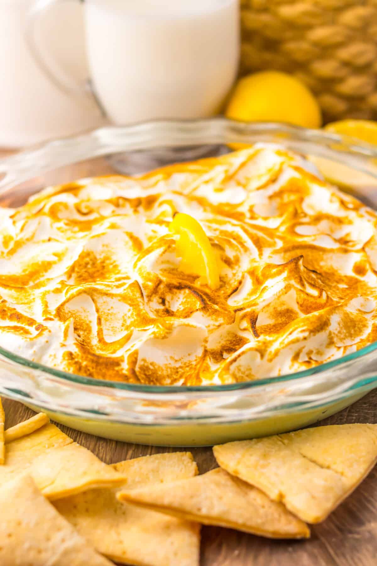 Lemon meringue pie dip served in a glass pie dish.
