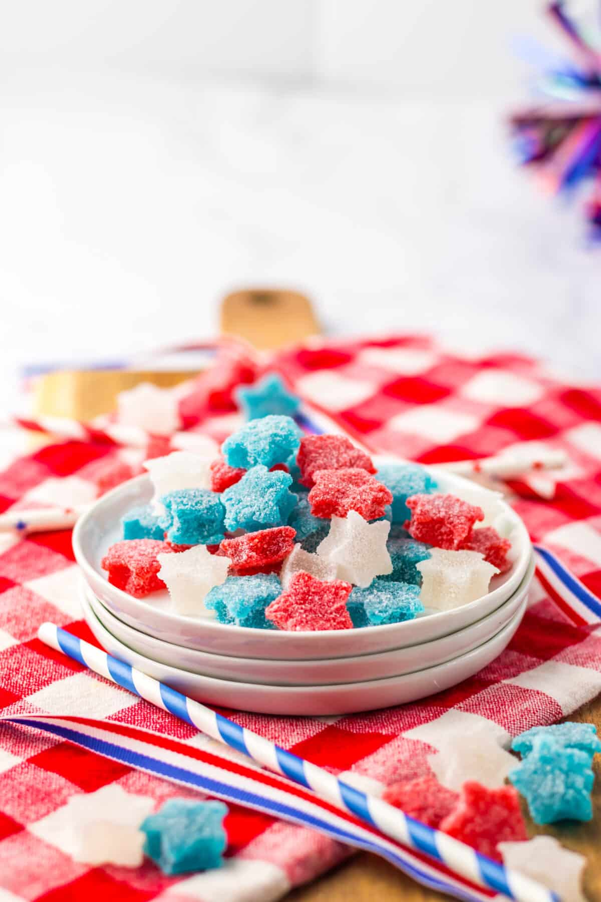 Close-up of red, white, and blue gumdrops shaped like stars.