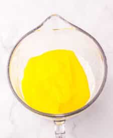 Lemon pie filling and cake mix in a bowl for two ingredient lemon bars.