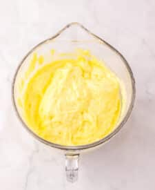 Lemon pie filling and cake mix in a bowl for two ingredient lemon bars.