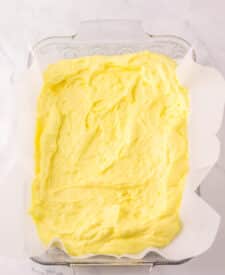 Lemon batter spread evenly into a baking dish.