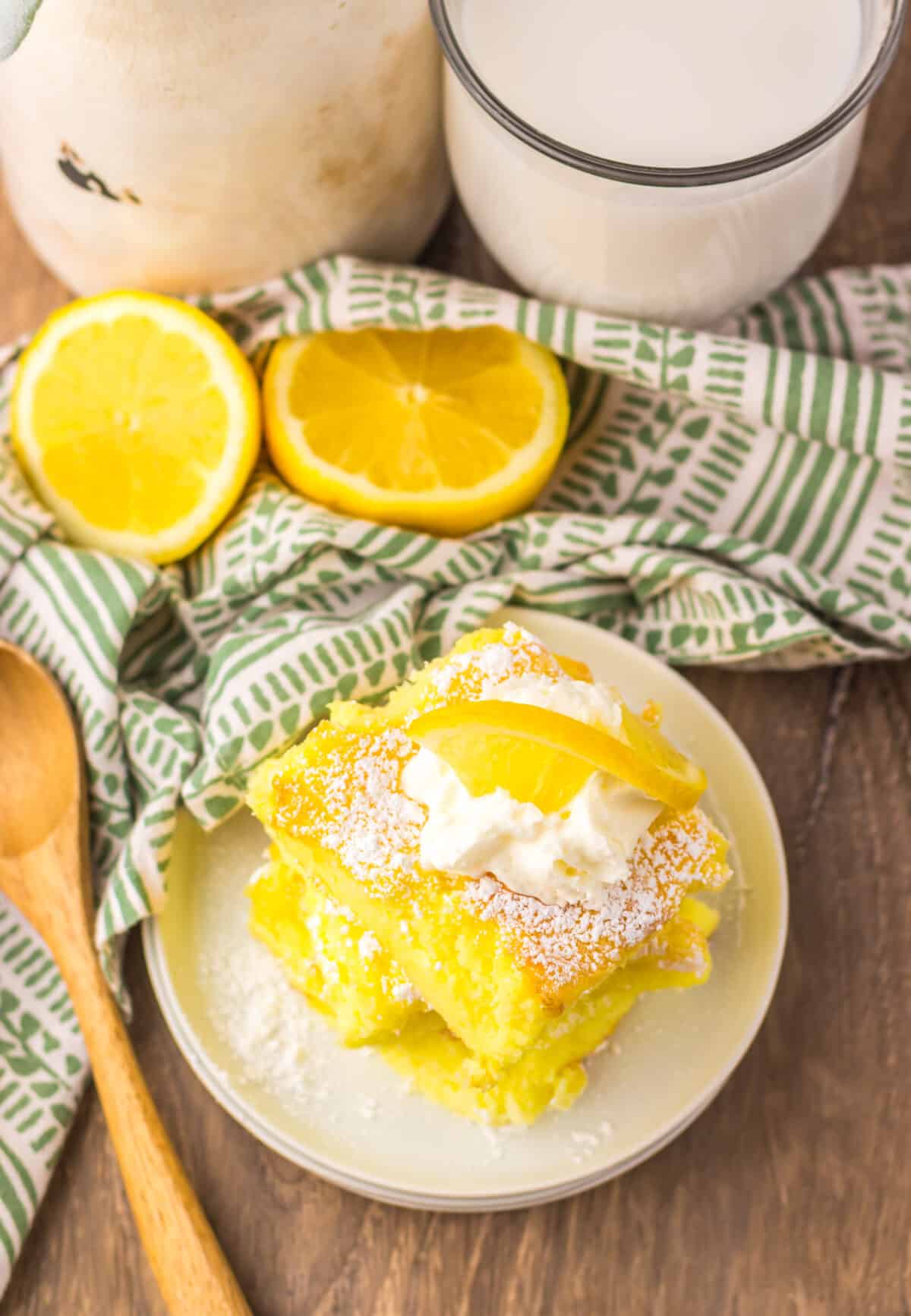 Close-up of fluffy lemon bars with powdered sugar topping.