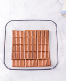 American flag s'mores dip ready to bake in a square baking dish.