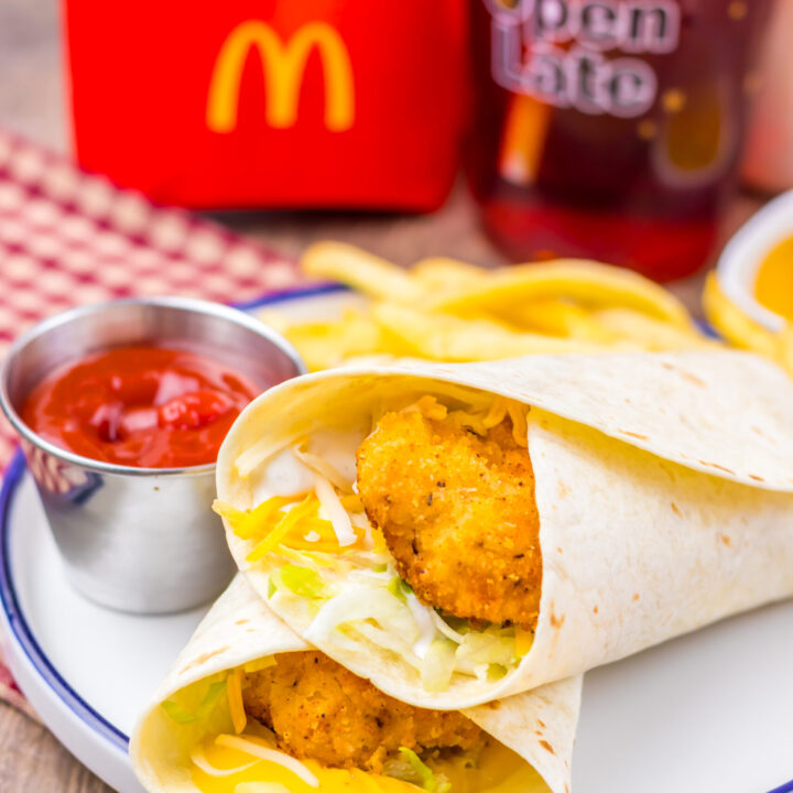 Homemade crispy chicken snack wrap meal with fries and ketchup.