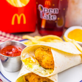 Homemade crispy chicken snack wrap meal with fries and ketchup.