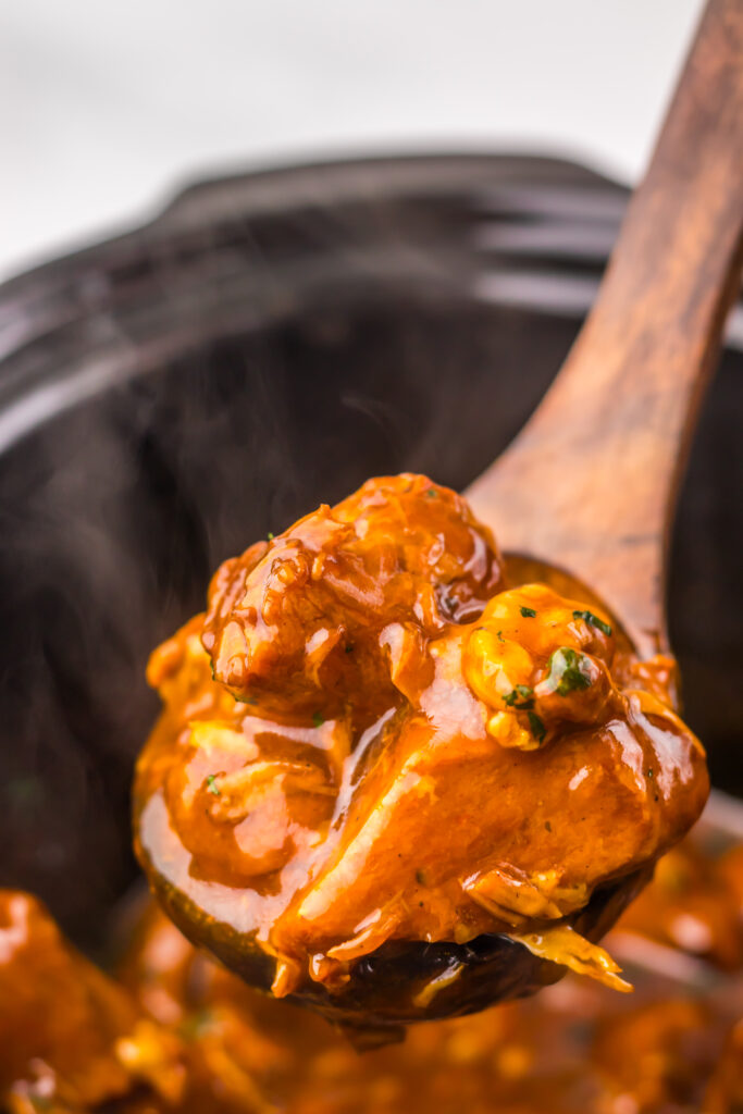 Close-up of tender Slow Cooker Dr Pepper BBQ Rib Bites coated in glossy barbecue sauce.
