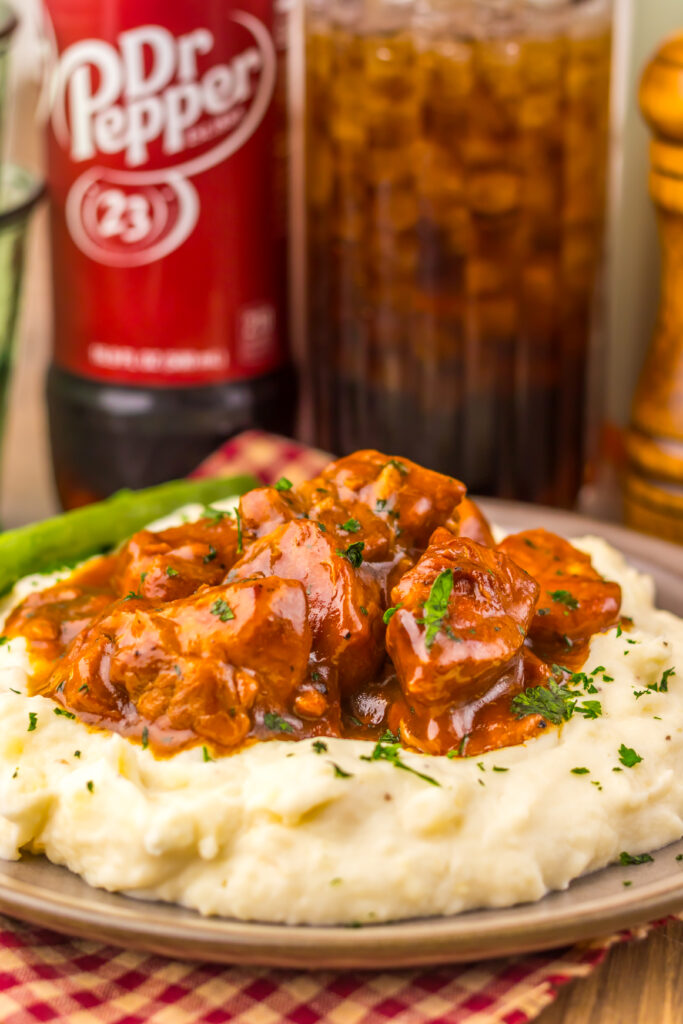 Close-up of Slow Cooker Dr Pepper BBQ Rib Bites served with mashed potatoes.