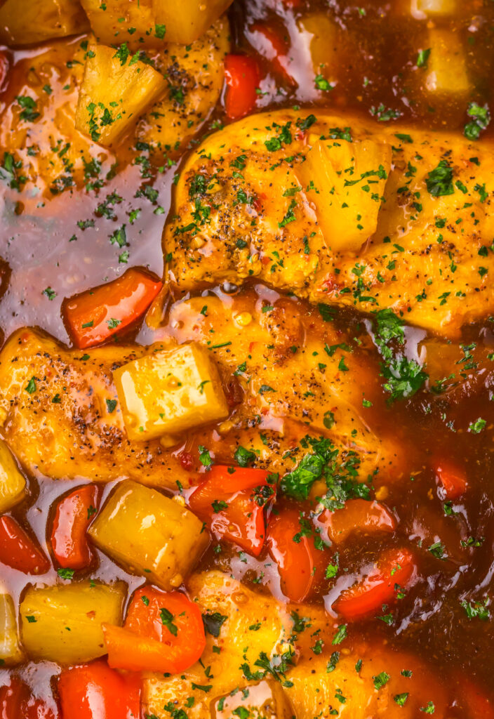 Sweet chili pineapple chicken simmering in the slow cooker.