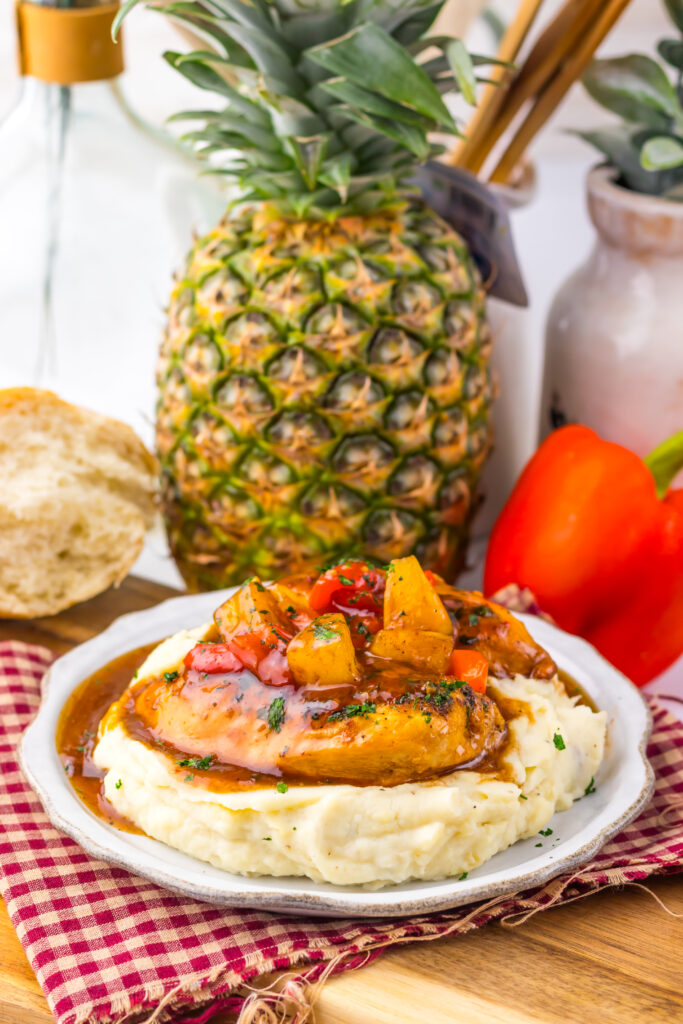 Close-up of Slow Cooker Sweet Chili Pineapple Chicken with pineapple and peppers.