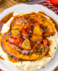 Close-up of Slow Cooker Sweet Chili Pineapple Chicken with pineapple and peppers.