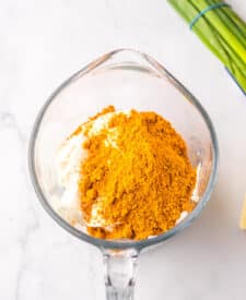 Cream cheese and taco seasoning mixture for layered taco dip.