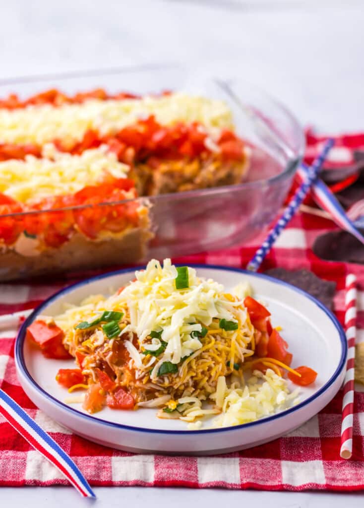 Flag Taco Dip served on a plate with tortilla chips.