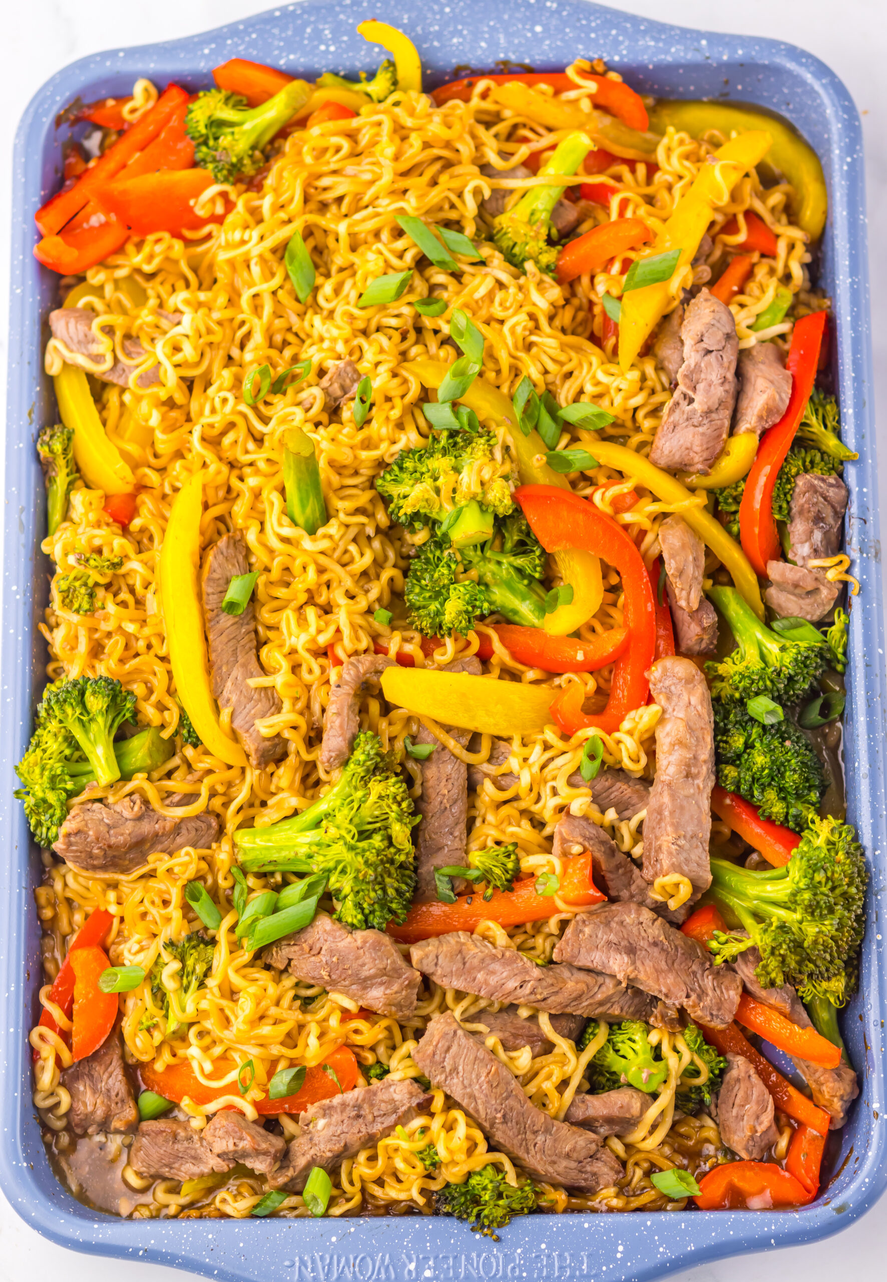 Close-up of baked Sheet Pan Beef Ramen with tender beef and vegetables.