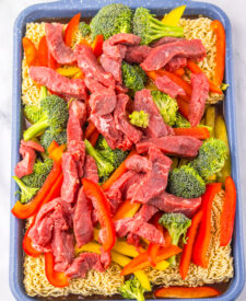 Thinly sliced beef and vegetables prepared for Sheet Pan Beef Ramen.
