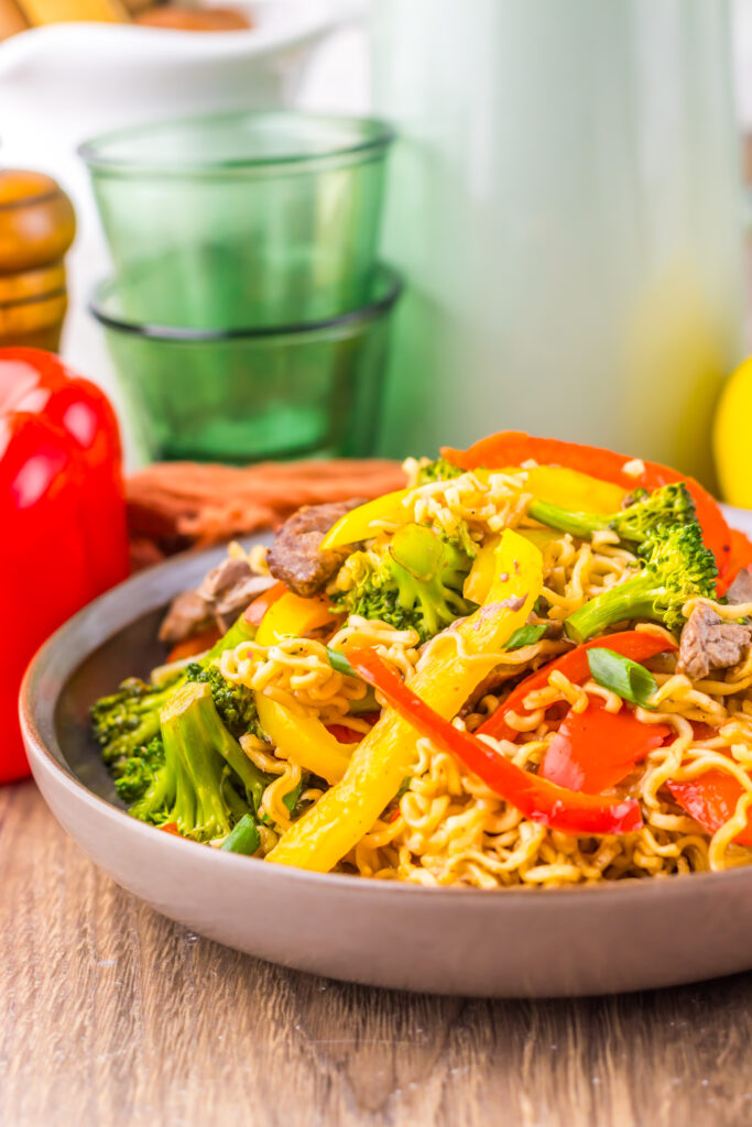 Sheet Pan Beef Ramen served on a plate with colorful vegetables.