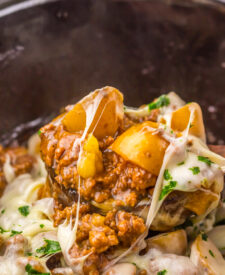Creamy French onion beef and potatoes spooned from the slow cooker.