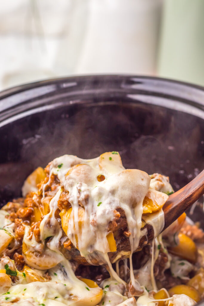 Creamy French onion beef and potatoes spooned from the slow cooker.