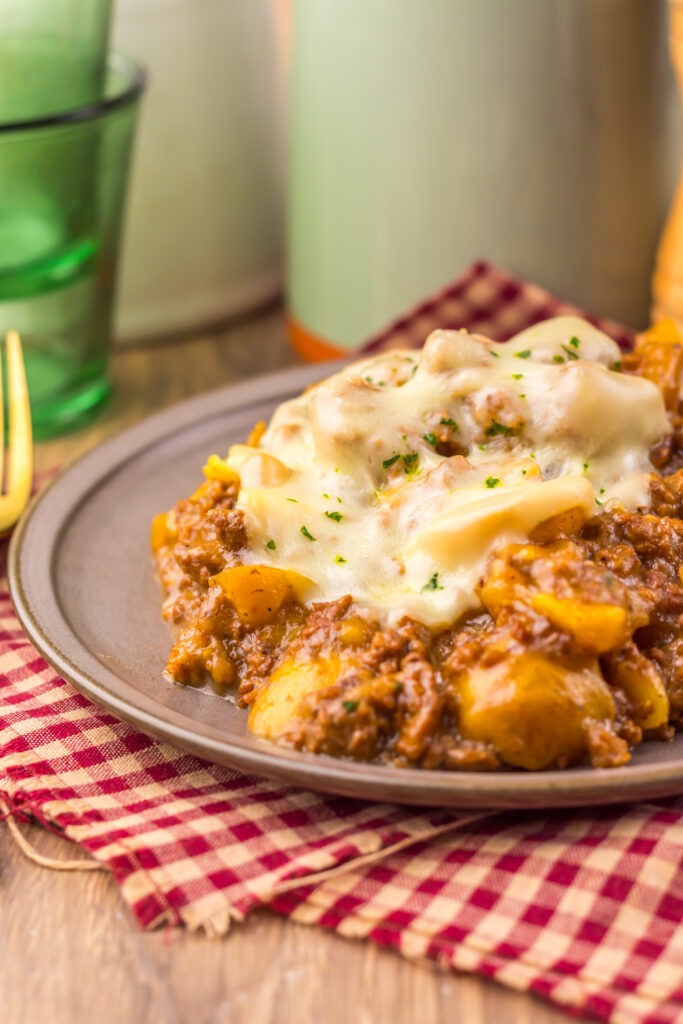 Slow Cooker French Onion Beef and Potatoes served hot with creamy French onion gravy.