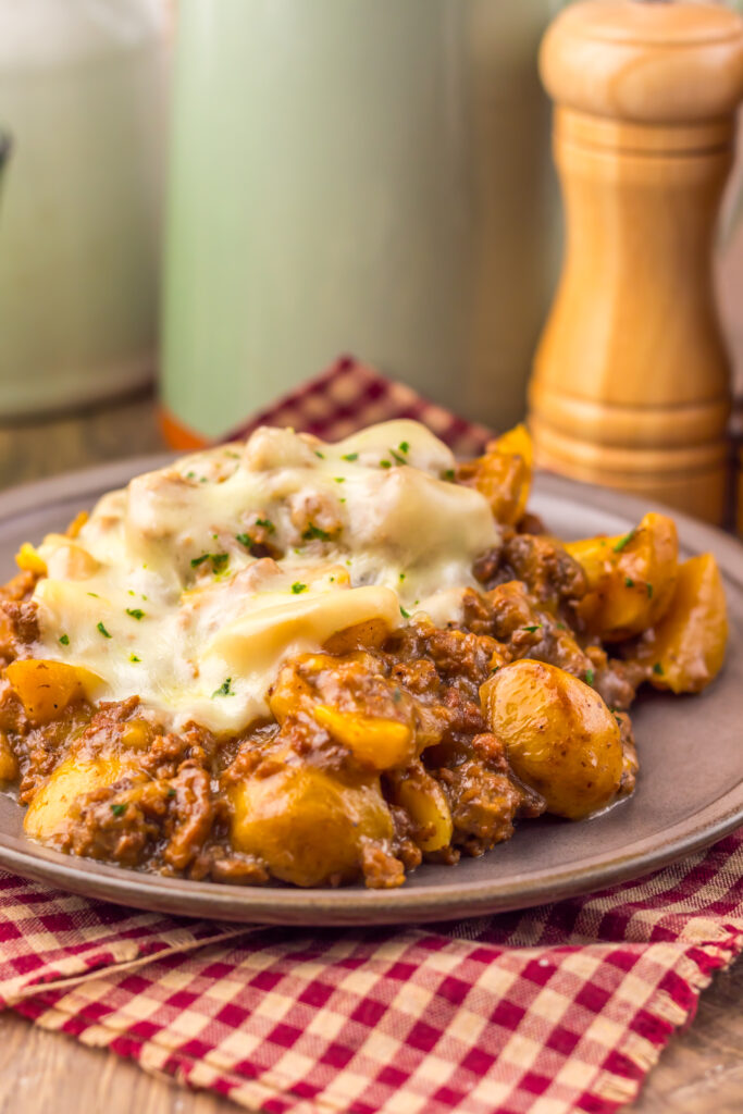Close-up of Slow Cooker French Onion Beef and Potatoes garnished with parsley.