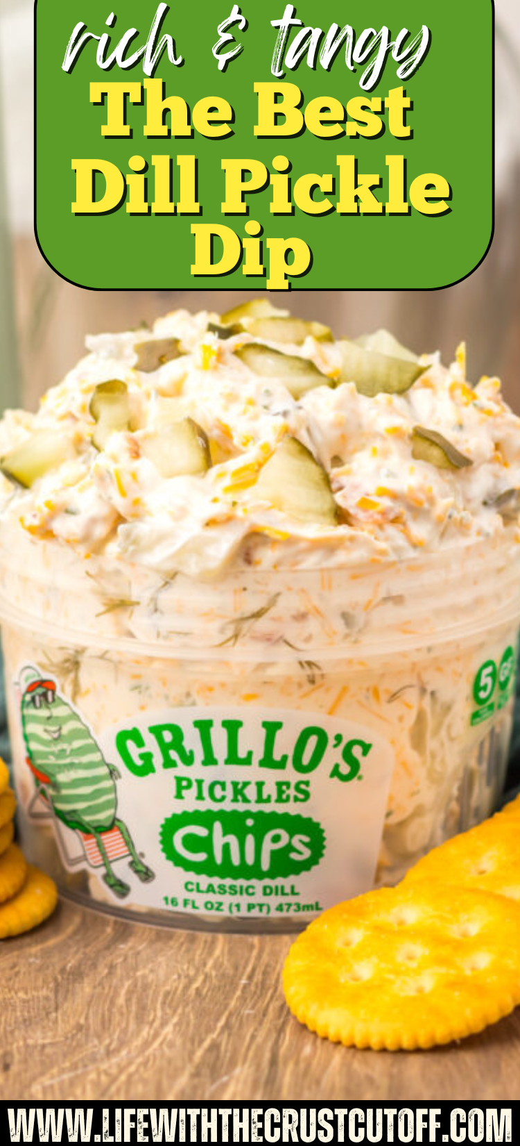 The Best Dill Pickle Dip served in a bowl with potato chips and fresh dill.