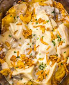Slow Cooker French Onion Ravioli cooking with melted cheese on top.