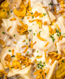 Cheesy French Onion Ravioli garnished with crispy fried onions.