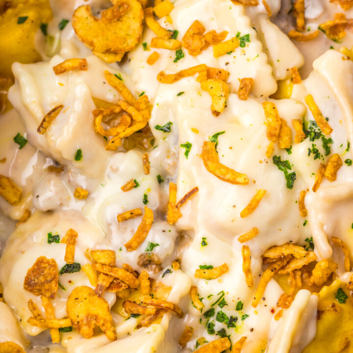 Cheesy French Onion Ravioli garnished with crispy fried onions.