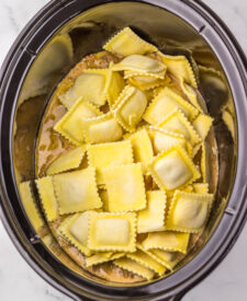Frozen cheese ravioli layered into the slow cooker with French onion sauce.