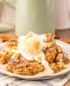 Snickerdoodle Cobbler topped with melting vanilla ice cream and cinnamon sugar.