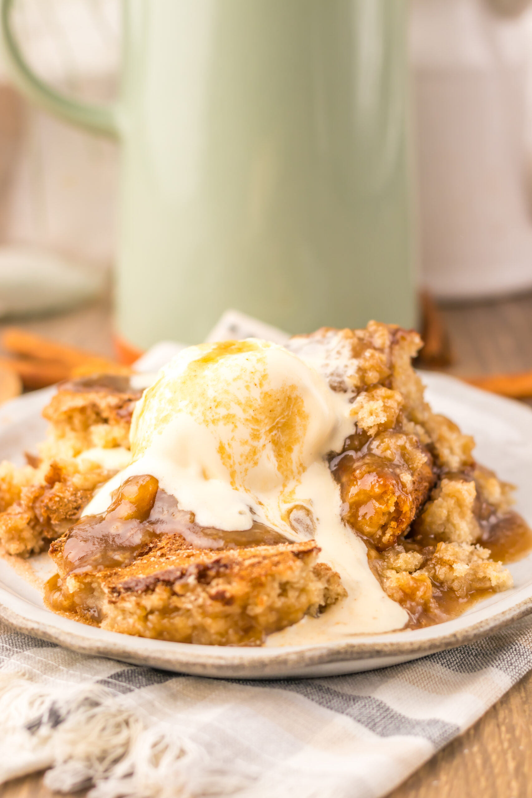Snickerdoodle Cobbler topped with melting vanilla ice cream and cinnamon sugar.