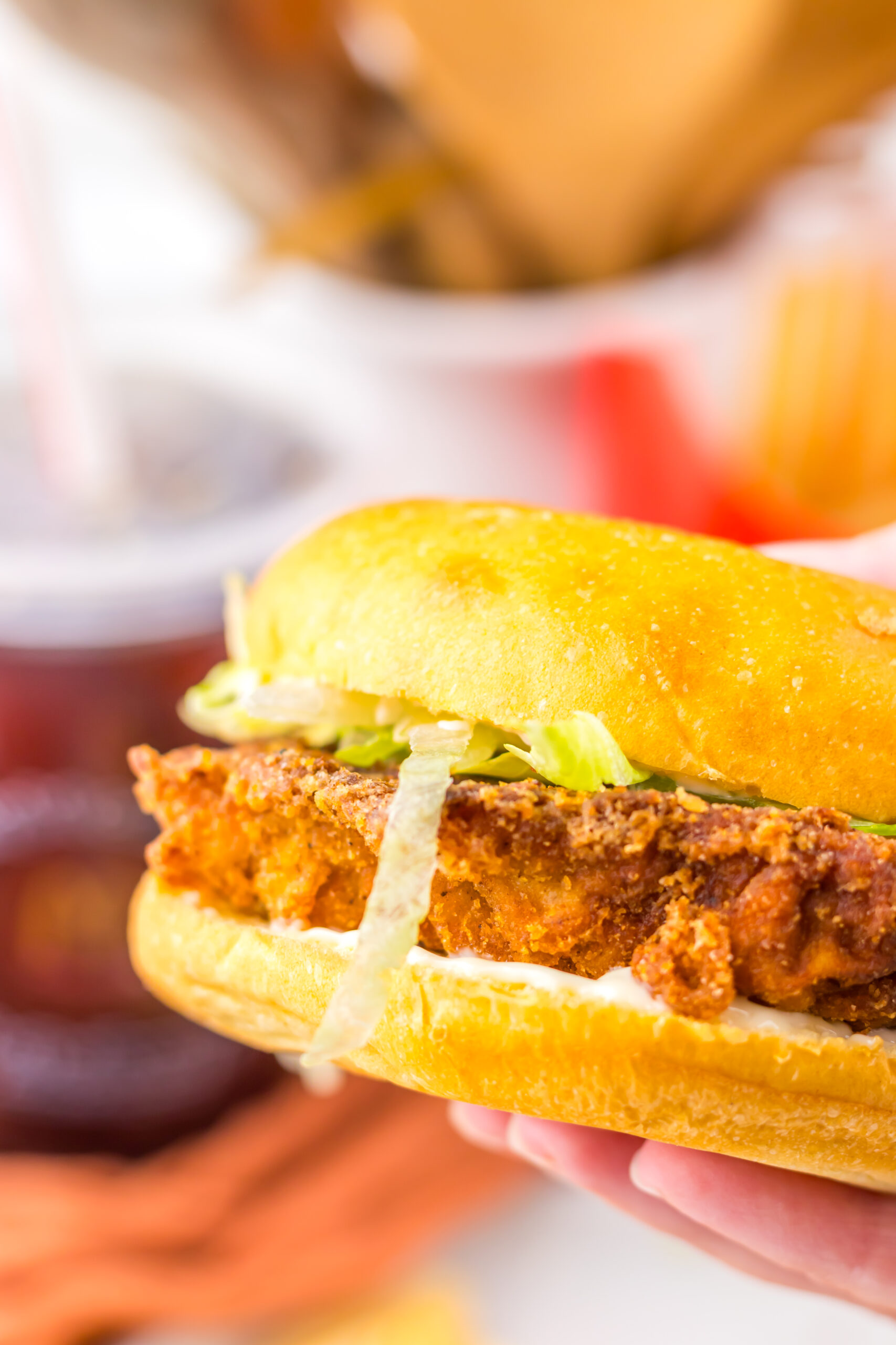 1. Close-up of the crispy spicy chicken patty and toppings on a McDonald’s Hot & Spicy Chicken Sandwich.